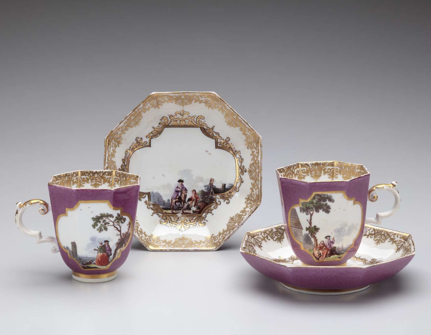 Meissen pair of cups and saucers with puce ground