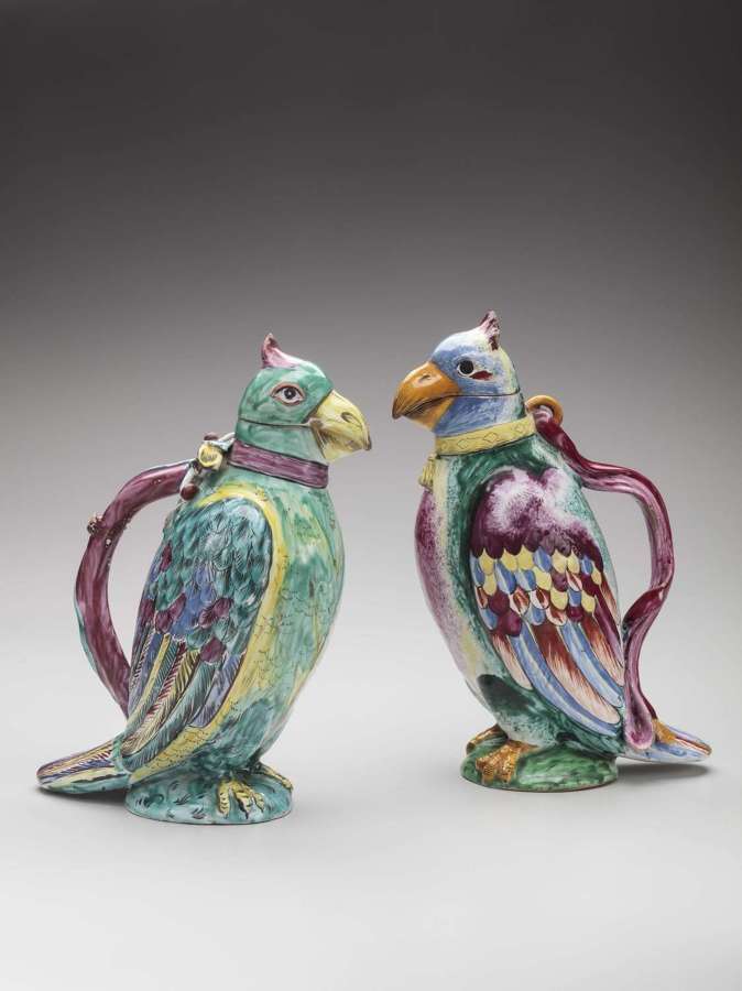 Holics faience pair of parrot jugs
